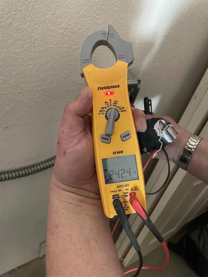 Voltage testing with clamp meter during Generator Installation in Willow Oak